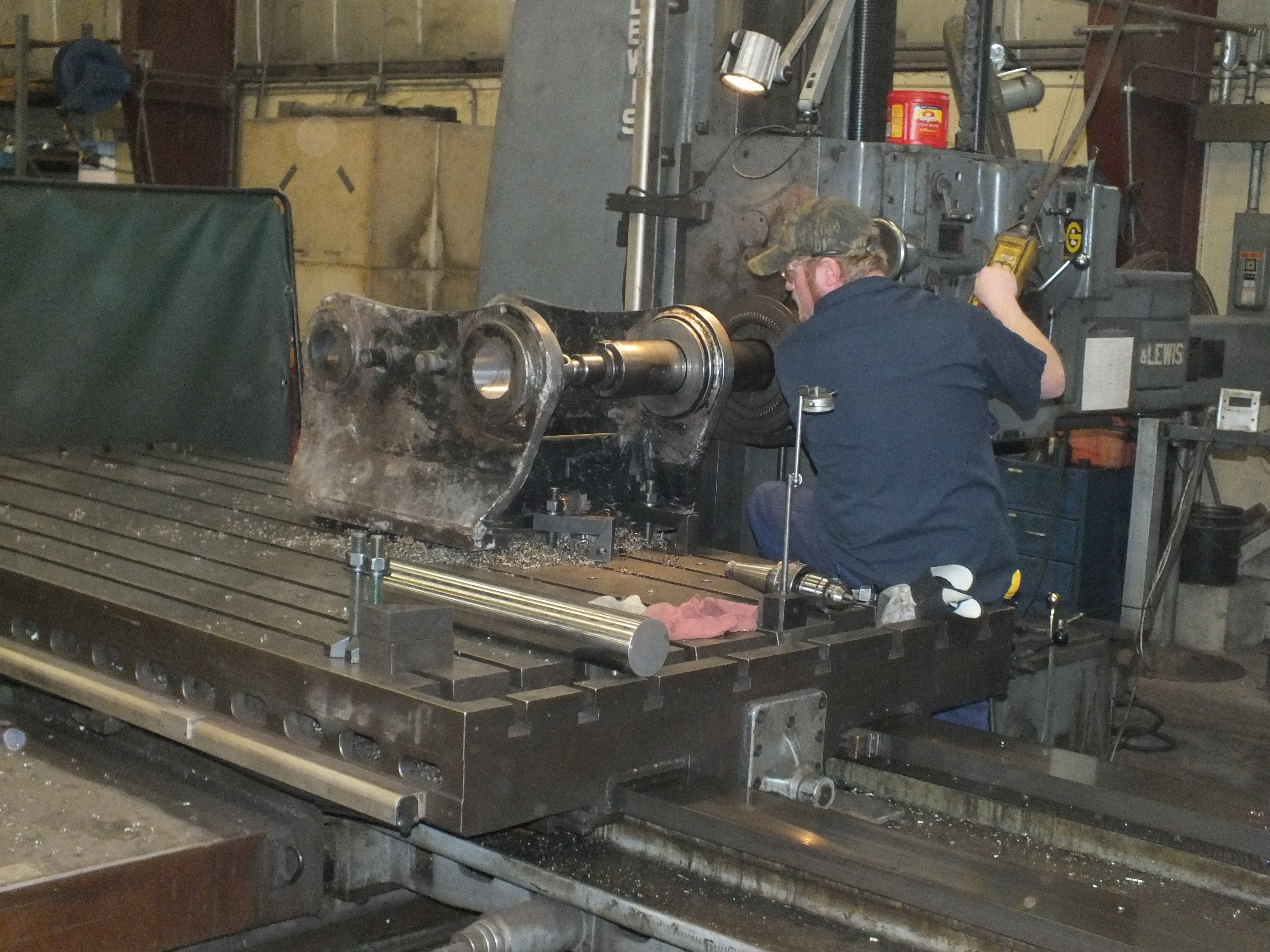 Machinery Maintenance employee prepping turning equipment